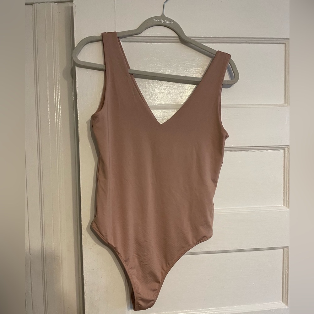 SOLD 
NWT pink v-neck bodysuit